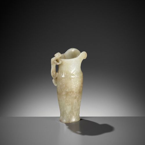 AN IMPERIAL CELADON AND RUSSET JADE 'CHILONG' RHYTON, QIANLONG MARK AND PERIOD 一&hellip;