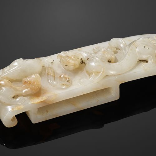 A 4-PART WHITE AND RUSSET JADE SWORD FITTING, WESTERN HAN 西汉白赤玉剑四件套

玉器。中国，西汉，2
&hellip;