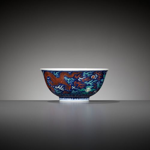 A RARE BLUE-GROUND POLYCHROME-DECORATED ‘DRAGON’ BOWL, QIANLONG MARK AND PERIOD &hellip;