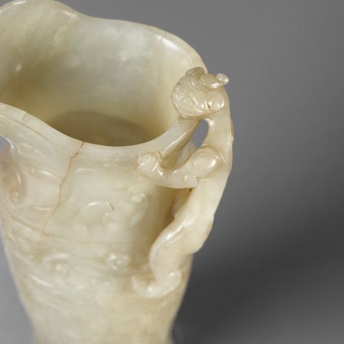 AN IMPERIAL CELADON AND RUSSET JADE ‘CHILONG’ RHYTON, QIANLONG MARK AND PERIOD E&hellip;