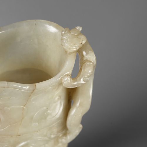 AN IMPERIAL CELADON AND RUSSET JADE ‘CHILONG’ RHYTON, QIANLONG MARK AND PERIOD E&hellip;