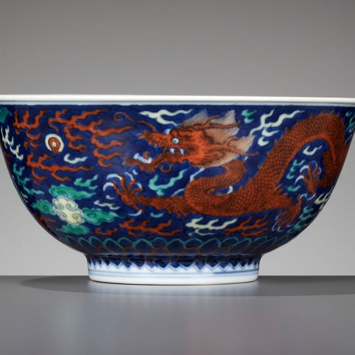 A RARE BLUE-GROUND POLYCHROME-DECORATED ‘DRAGON’ BOWL, QIANLONG MARK AND PERIOD &hellip;