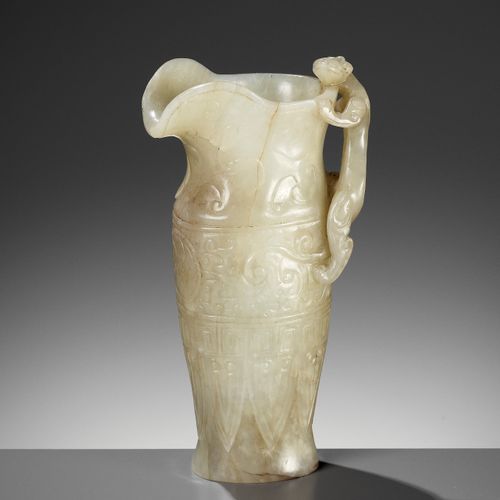 AN IMPERIAL CELADON AND RUSSET JADE ‘CHILONG’ RHYTON, QIANLONG MARK AND PERIOD U&hellip;