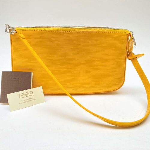 LOUIS VUITTON 
Lexington" clutch bag in yellow epi leather, zipper, short handle&hellip;