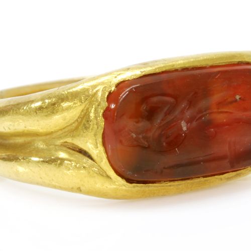 Null A high carat gold carved cornelian intaglio ring,