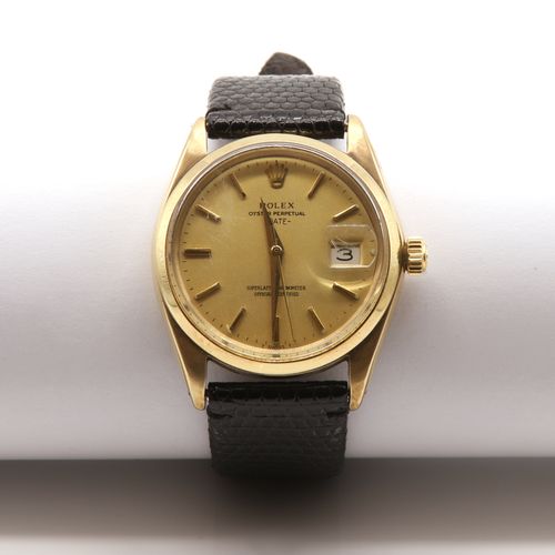 Null A gentlemen's 9ct gold Rolex Oyster Perpetual date automatic strap watch,