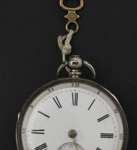 Null Silver objects - Great Britain - A silver pocketwatch, white enamel dial wi&hellip;