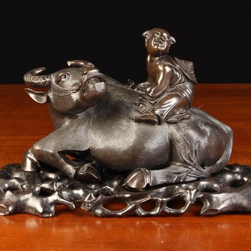 Null A Fine Qing Period Ebony Carving of a Reclining Water Buffalo carrying a Ch&hellip;
