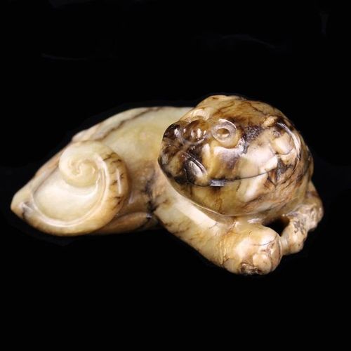 Null A Chinese Ming Jade Carving of a reclining dog with dark russet inclusions,&hellip;