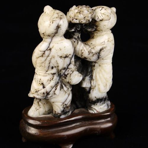 Null A Ming Period Jade Carving of The He-he Twins holding between them a vase o&hellip;
