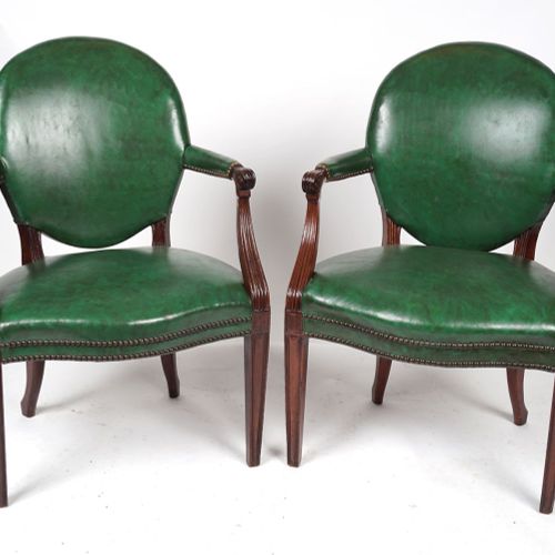 PAIR OF GEORGE III LEATHER LIBRARY ARMCHAIRS Each an oval upholstered back and s&hellip;