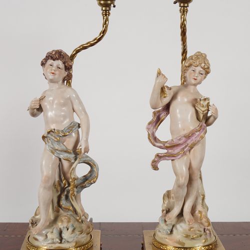 PAIR OF CAPODIMONTE FIGURAL TABLE LAMPS and shades, each raised on a brass squar&hellip;