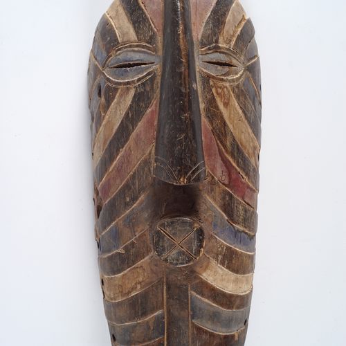 CARVED AFRICAN SONGYE MASK with polychrome decoration. 45 cm. High; 18 cm. Wide