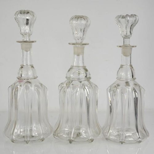 Null Three moulded glass decanters with stoppers.