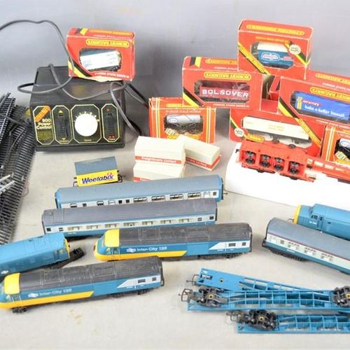 Null A group of Hornby 00 gauge locomotives and carriages, wagons in original bo&hellip;