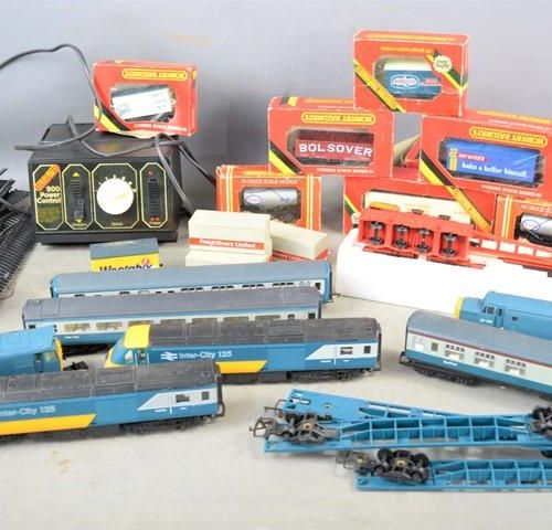 Null A group of Hornby 00 gauge locomotives and carriages, wagons in original bo&hellip;