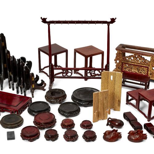 Null A large collection of Chinese wood stands, 20th century, to include a brush&hellip;