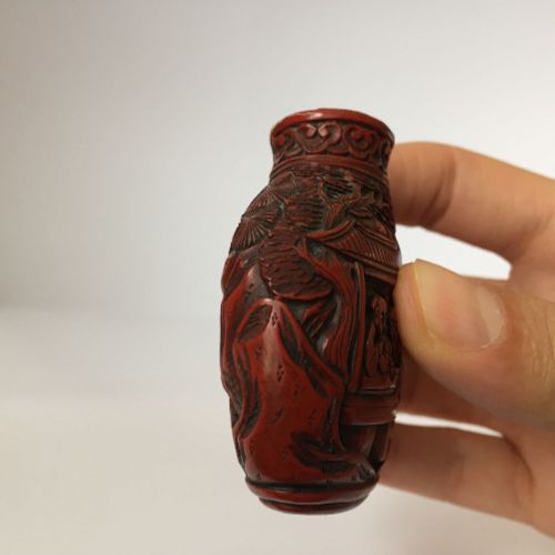 Null A Chinese porcelain snuff bottle and a cinnabar lacquer-type snuff bottle, &hellip;