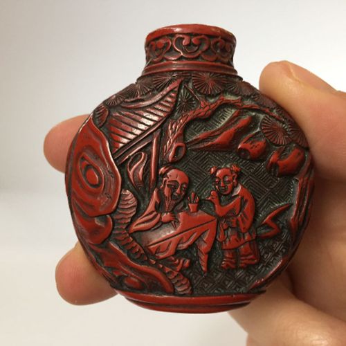 Null A Chinese porcelain snuff bottle and a cinnabar lacquer-type snuff bottle, &hellip;