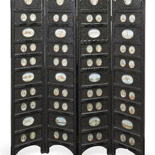 Null A finely carved ebony four-fold screen and occasional table, North India, s&hellip;