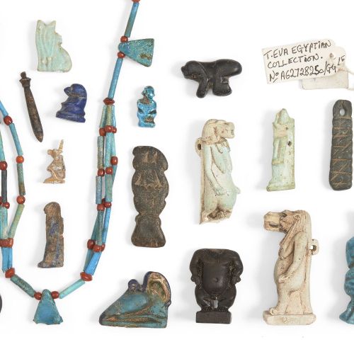 Null A group of 26 Egyptian amuletic pieces, including rings, in faience, stone &hellip;