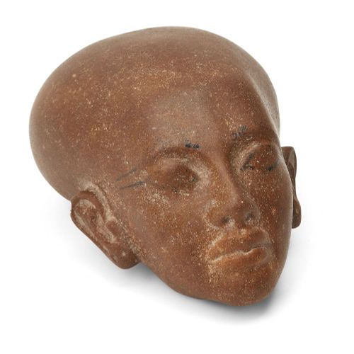 Null An Egyptian style brown quartzite head of an Amarna style princess, with el&hellip;