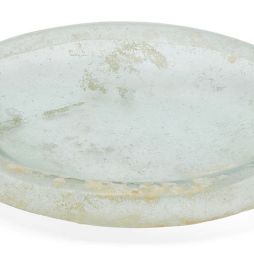 Null A Roman clear glass dish and a lid, 2nd-4th century AD, the first of deep f&hellip;