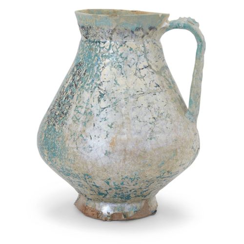 Null Une cruche à pied en poterie à glaçure turquoise de Kashan,

Kashan, Perse &hellip;