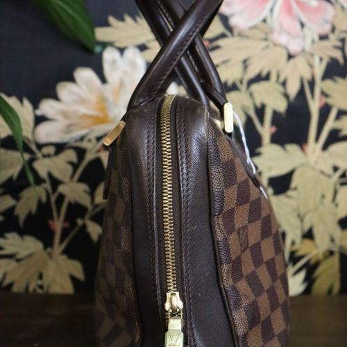 LOUIS VUITTON. Bowling bag in checkerboard canvas and br…