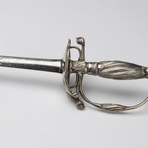 A Dutch ceremonial sword with silver grip and steel blade 一把荷兰礼仪用剑，银质手柄和钢质剑身，有车削&hellip;