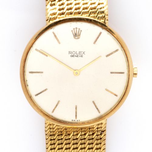 An 18k gold gentlemen's wristwatch, by Rolex 劳力士18K金绅士腕表，机械机芯，银色圆形表盘上有棍子，配以可能是后来&hellip;