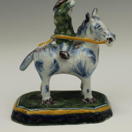 A small Delft pottery figure of a man on a horse A small Delft pottery figure of&hellip;