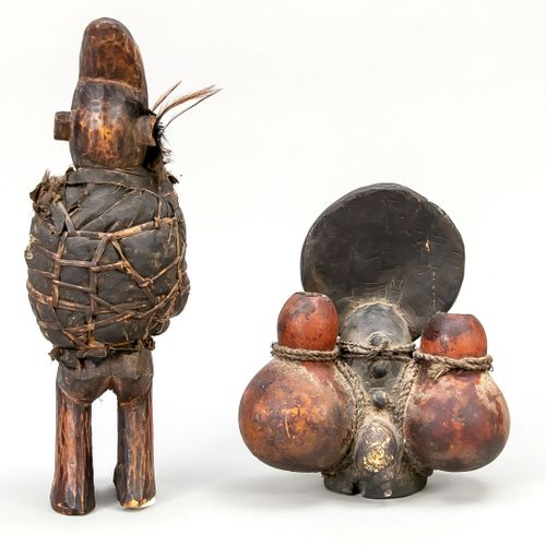 Null 2个拜物教人物，1个Swaheli/坦桑尼亚的人物，头部呈圆盘状，侧面有2个盛放魔法的水瓶，人物的背面有连接的蜗牛和1个用天然纤维包裹的 "魔法货物"&hellip;