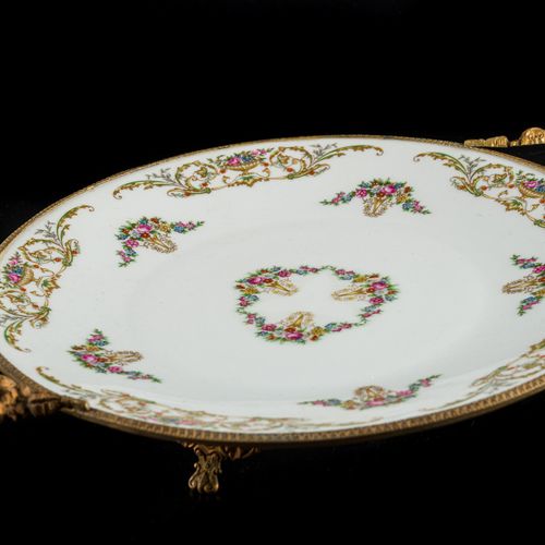Limoges centerpiece in porcelain with painted floral motifs, with gilt bronze de&hellip;
