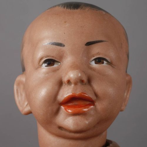 Null 
Kämmer & Reinhardt porcelain head doll 
as a so-called "Negro doll", c. 19&hellip;