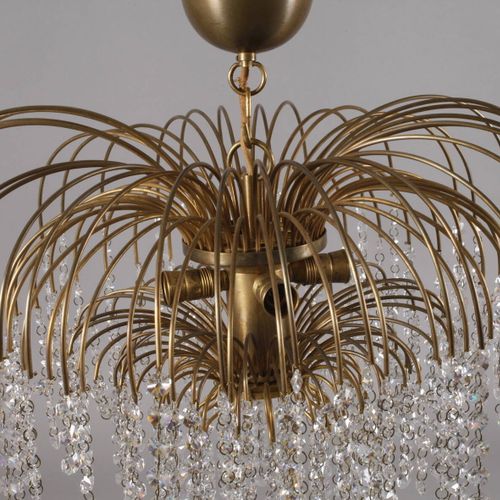 Null 
吸顶灯设计
意大利，20世纪70年代，黄铜，模型由无数精致的弧形辐条装饰，呈棕榈状，这些辐条上悬挂着施华洛世奇水晶，多火焰通电，不是很完整，就年龄而&hellip;