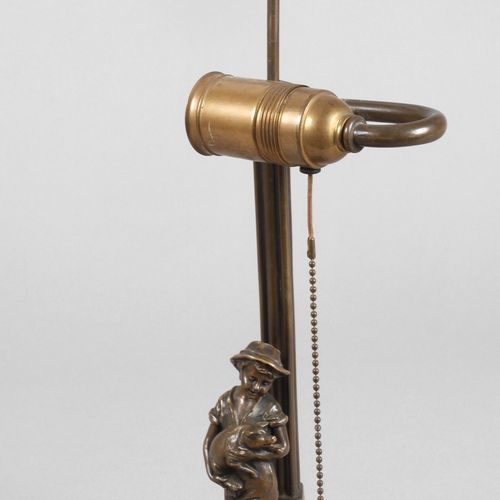 Null 
Pied de lampe "Hans im Glück".
Vers 1900, non signé, bronze patiné clair, &hellip;