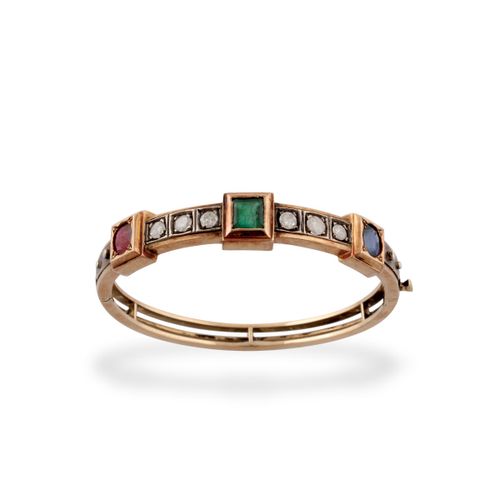 BRACCIALE rigid in yellow gold and silver with sapphire, emerald and ruby placed&hellip;