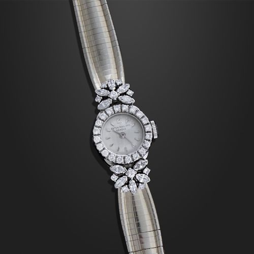 PATEK PHILIPPE Ladies watch in 18K white gold and diamonds with gold bracelet. M&hellip;