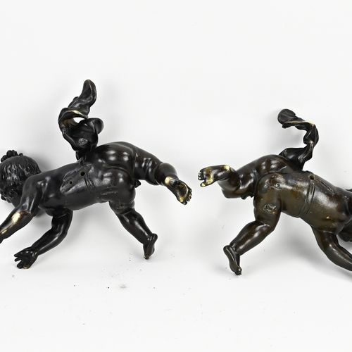 Null Two large 19th century French bronze puttis. Boy + girl. Browned. Dimension&hellip;