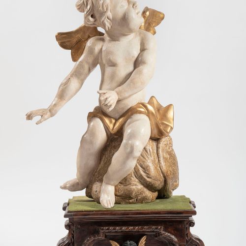 Putto on Cloud Pedestal, 18th century Bois sculpté, peint en blanc et or.

Haute&hellip;