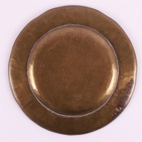 Null A bronze offering dish with silver medallion from Shiva, India around 1900.