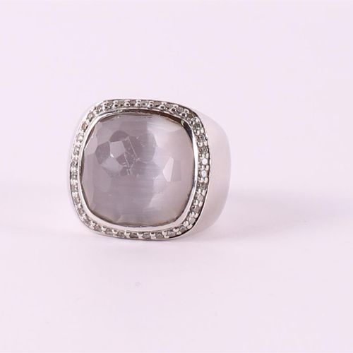 Null A 1st grade silver ring with a facet cut gray stone and zirconias.