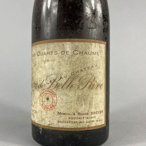 Une bouteille de Château Belle Rive, 
Clos des Quarts de Chaume 1955, 
Coteaux d&hellip;