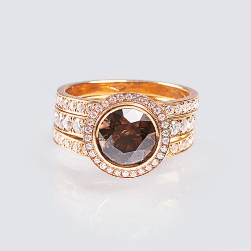 A Fancy Diamond Solitaire Ring with Diamonds. 18 ct. Red gold, marked. The Fancy&hellip;