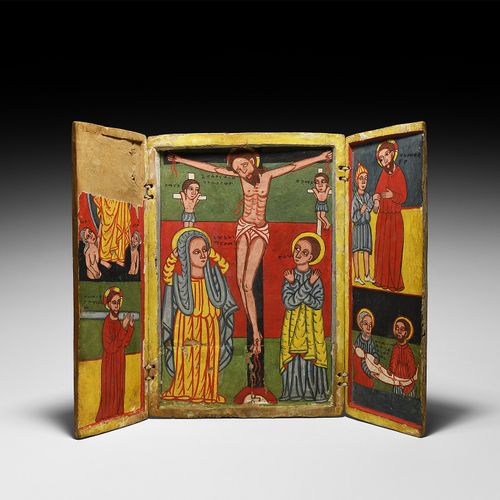Null 埃塞俄比亚的三联画，有耶稣受难和基督生活的场景。公元1680-1700年。木制圣像，有凹陷的中央面板和两个折叠门，右边的门上有一个红漆的十字架；中央面&hellip;