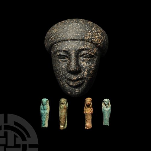 Null 来自石棺的埃及花岗岩面具。晚期，公元前664-332年。一个黑色花岗岩雕刻的头像，可能曾经是石棺的一部分，年轻的脸庞有着理想化的特征，戴着袋装假发，低&hellip;