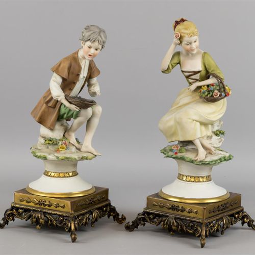 Null Two bisque porcelain sculptures on brass base, boy with fish on plate and g&hellip;