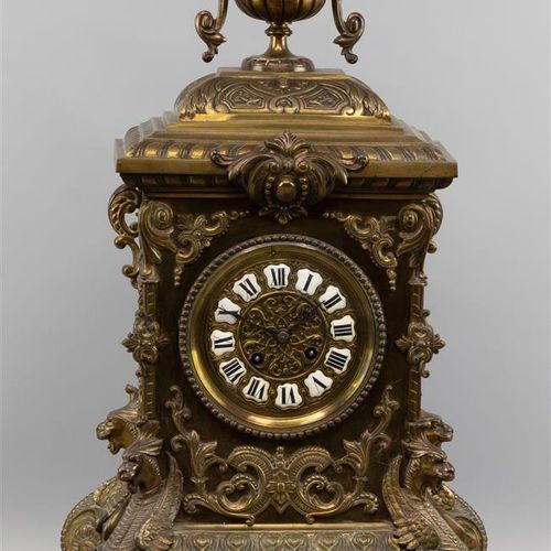 Null A chimney clock in richly decorated brass case resting on claw feet, dial w&hellip;