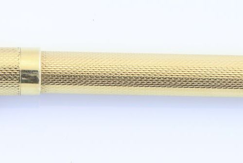 Een vulpotlood Oro 14 ct. Con decorazione guilloché. A- l. 12,5 cm e 22 grammi